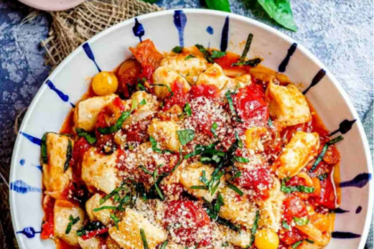 Soft homemade ricotta gnocchi served with butter, Parmesan, and fresh herbs.